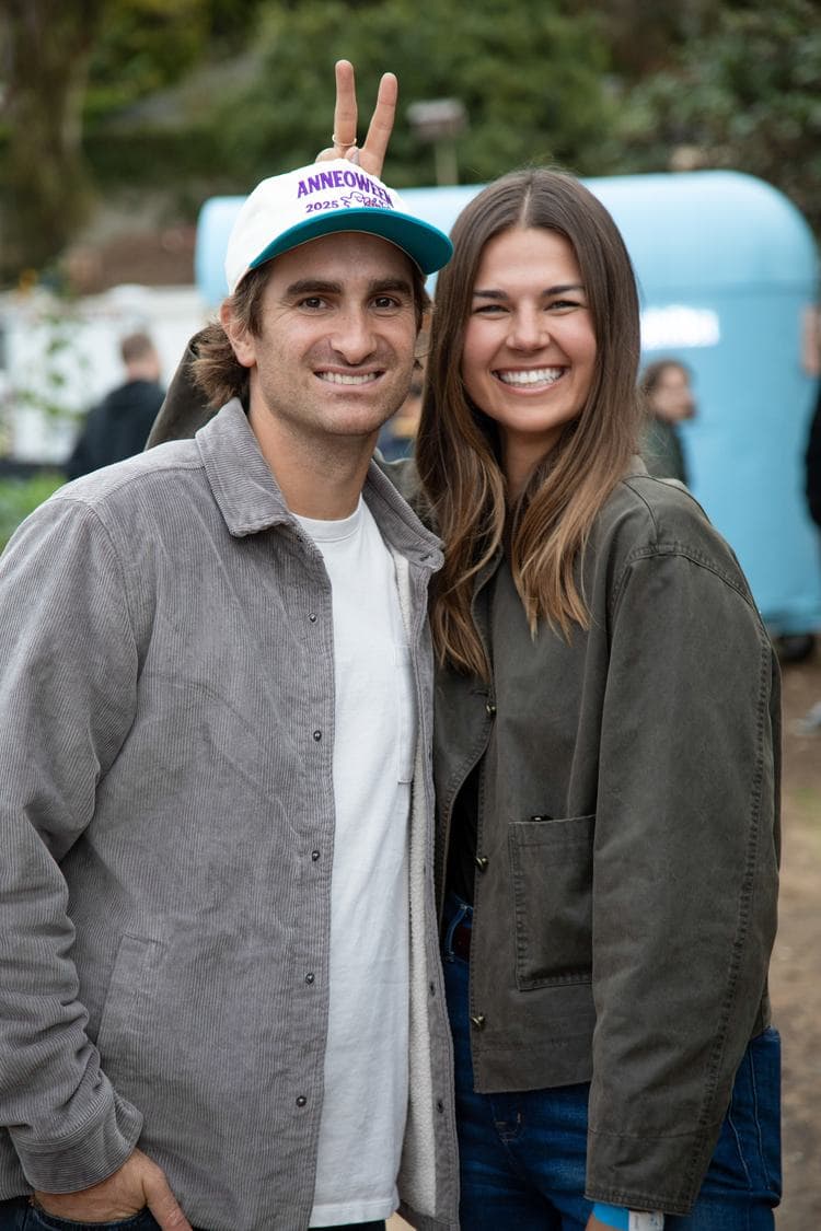 A couple posing in front of the cart